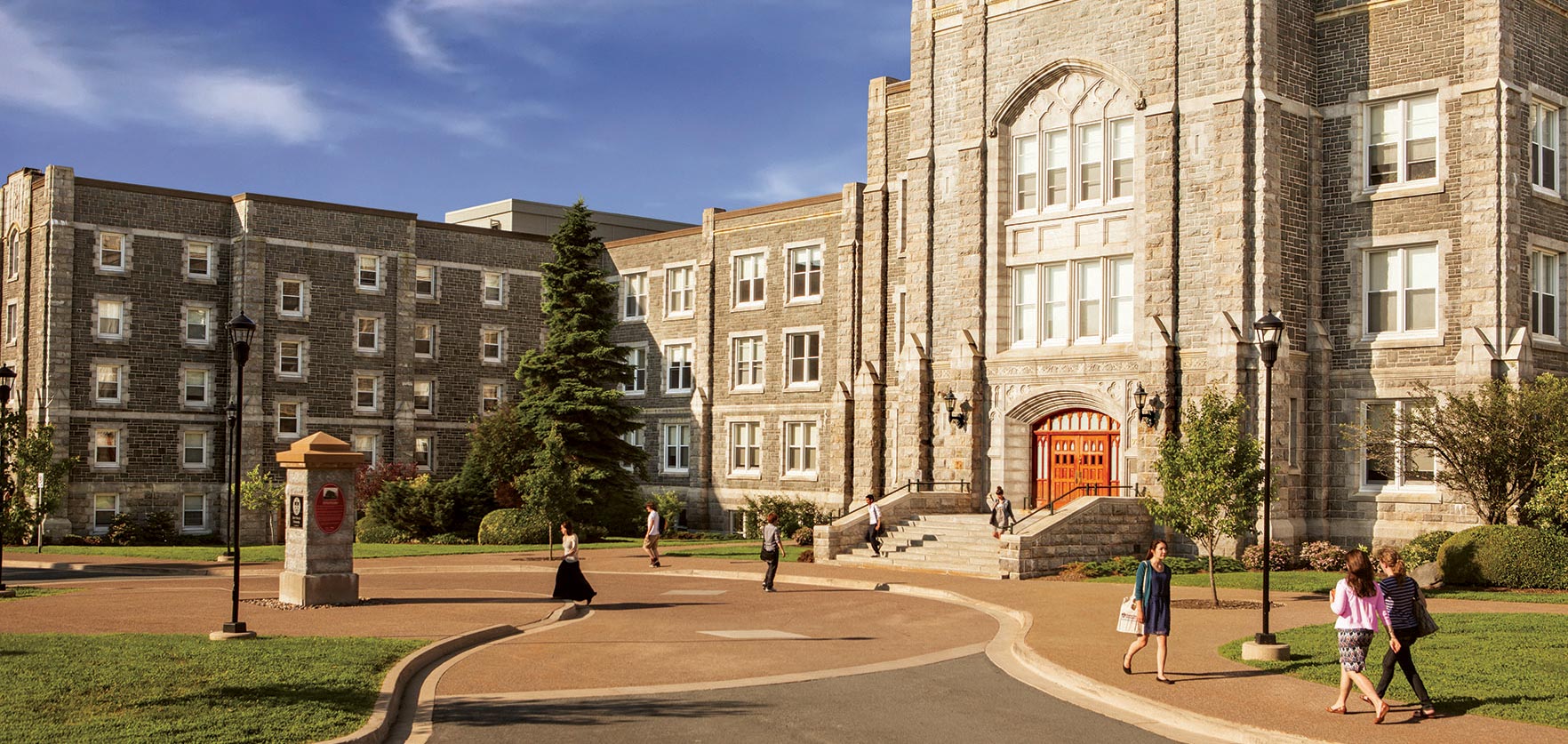 People walking past the McNally Building